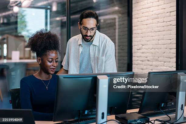 software engineers collaborating on a project, discussing on customer requirement concept, working flow diagram and analyzing code on computer monitors in office - software development training stock pictures, royalty-free photos & images