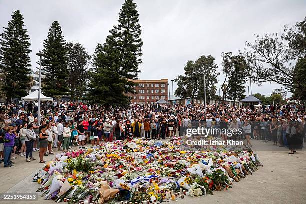 Mourners gather to lay flowers at Bondi Beach on December 15, 2025 in Sydney, Australia. Police say at least 16 people, including one suspected...