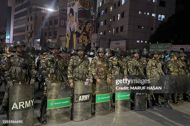 This frame grab from AFPTV video footage taken on December 19, 2025 shows military personnel standing guard in Dhaka, amid protests following the...