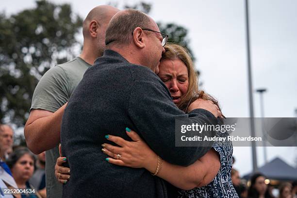 The parents of 10-year-old shooting victim, Matilda Poltavchenko, attend a memorial at Bondi Pavilion at Bondi Beach on December 15, 2025 in Sydney,...