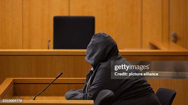December 2025, North Rhine-Westphalia, Aachen: The defendant sits in a courtroom at the regional court. The verdict is expected in the trial against...