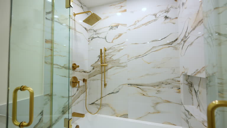 https://media.gettyimages.com/id/2252130538/video/luxury-bathroom-featuring-a-glass-enclosed-shower-with-elegant-gold-fixtures-the-marble-style.jpg?b=1&s=640x640&k=20&c=DWswoAV3uXZIHbYAnI7bbRYHNw0PowsWe5F5L54iLnI=