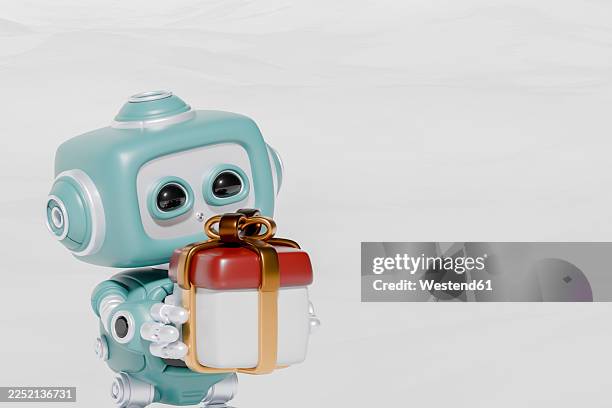 3d robot holding a christmas gift with happy expression on white - engineering machinery stock illustrations