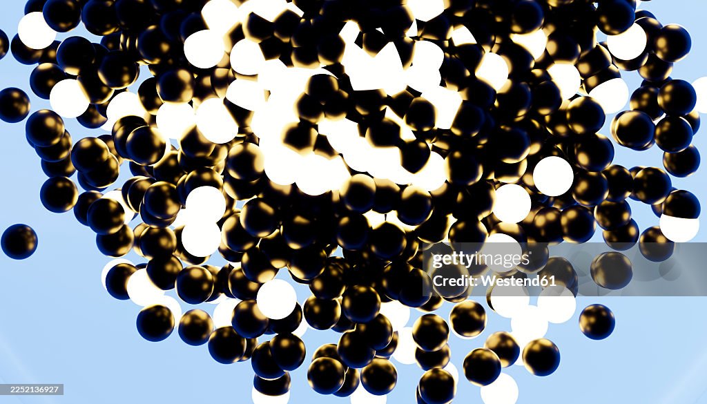 Abstract glowing black and white spheres floating dynamically