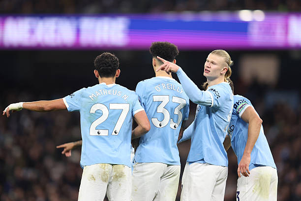 Erling Haaland of Manchester City gestures as he stands in the defensive wall during the Premier League match between Manchester City and West Ham...