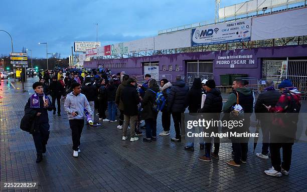 Fans queue to get into the stadium prior to the Copa del Rey match between CD Guadalajara and FC Barcelona at Estadio Pedro Escartin on December 16,...