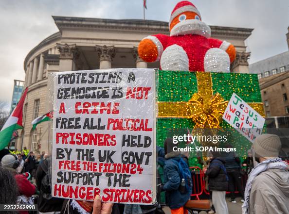 Sample Rally Placards A protester holds a placard during the rally. An increased police ...
