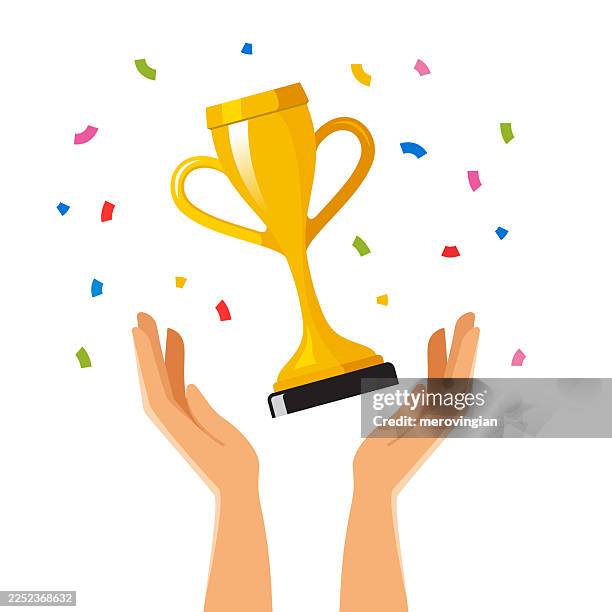 hands holding golden trophy with confetti - sports trophy stock illustrations