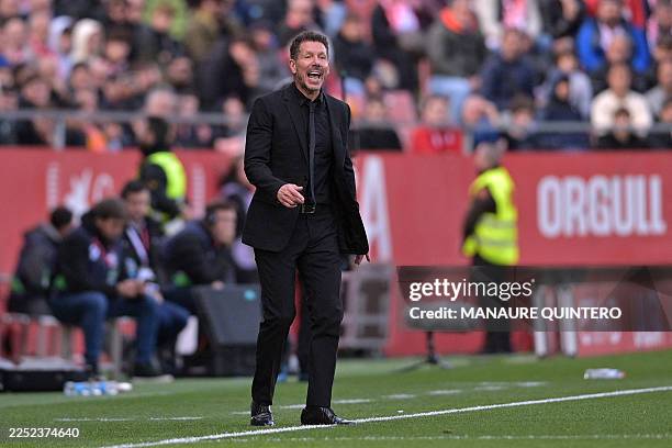 Atletico Madrid's Argentine coach Diego Simeone reacts during the Spanish league football match between Girona FC and Club Atletico de Madrid at...