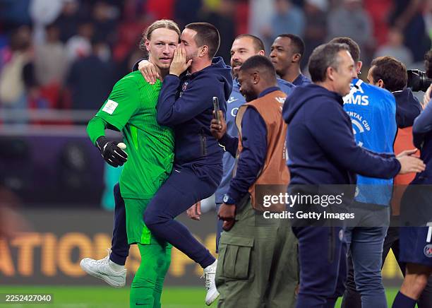 Matvey Safonov of Paris Saint-Germain is mobbed his teammates after they win the penalty shoot out during the FIFA Intercontinental Cup 2025 final...