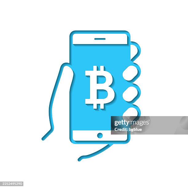 smartphone with bitcoin sign. icon cut out on white paper with blue background - holding blank iphone stock illustrations
