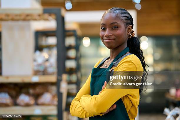 confident female small business owner working in grocery store - saleswoman stock pictures, royalty-free photos & images