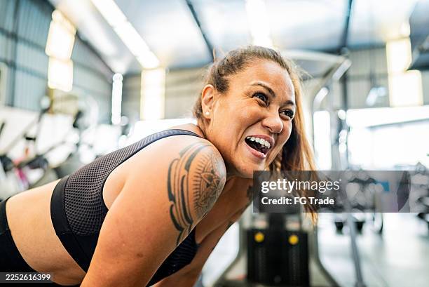 excited mature woman during workout at gym - self improvement stock pictures, royalty-free photos & images