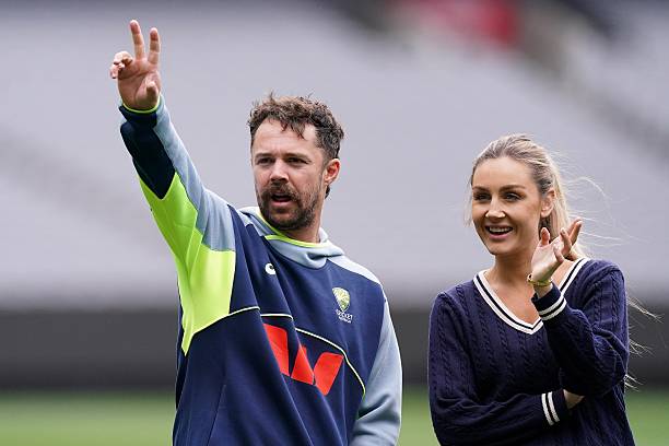 Australia's Travis Head waves to someone with his wife Jessica Head during a nets session at the Melbourne Cricket Ground, Australia. Picture date:...