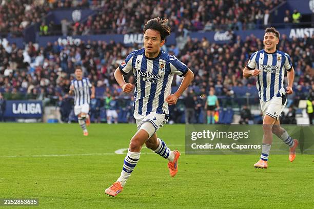 Takefusa Kubo of Real Sociedad celebrates scoring his team's first goal during the LaLiga EA Sports match between Levante UD and Real Sociedad at...