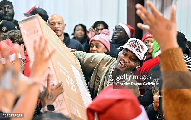 Rapper Offset is seen handing out smart TVs during his 4th Annual Toys 4 The Nawf Christmas Charity event on December 20, 2025 in Norcross, Georgia.