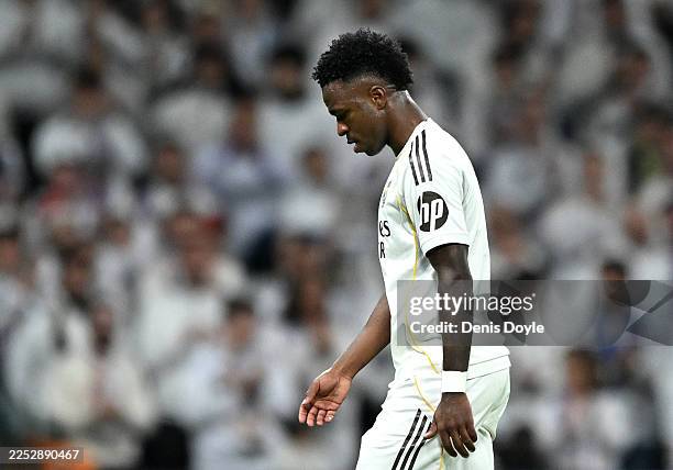 Vinicius Junior of Real Madrid walks off the pitch to be substituted for Gonzalo Garcia during the LaLiga EA Sports match between Real Madrid CF and...