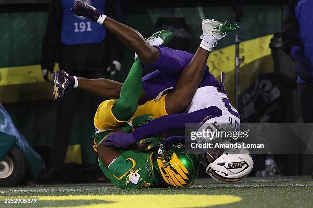 Jeremiah McClellan of the Oregon Ducks catches a pass for a touchdown while defended by DJ Barksdale of the James Madison Dukes during the 2025...