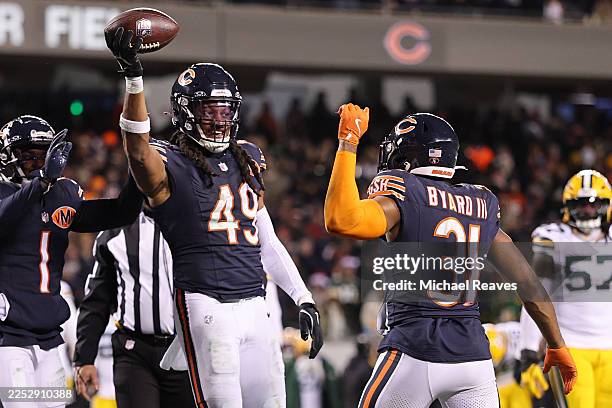 Tremaine Edmunds of the Chicago Bears celebrates with Kevin Byard III after his fumble recovery against the Green Bay Packers during the third...
