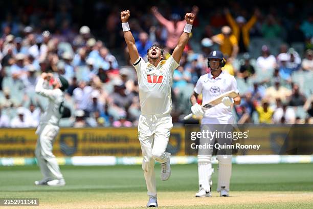 Mitchell Starc of Australia celebrates taking the wicket of Will Jacks of England for 47 runs during day five of the Third Test Match in the 2025-26...