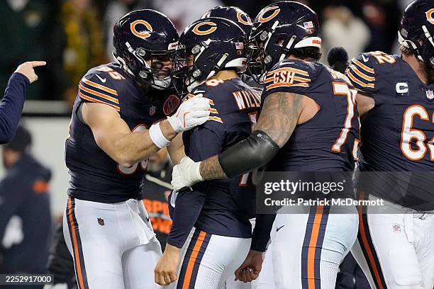 Caleb Williams of the Chicago Bears celebrates a game-winning touchdown pass to DJ Moore to defeat the Green Bay Packers at Soldier Field on December...