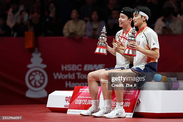 Gold medallists Kim Won Ho and Seo Seung Jae of South Korea pose with the trophies during the award ceremony for Men's Doubles Final match at the BWF...