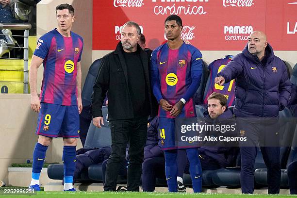 Hansi Flick, Head Coach of FC Barcelona, prepares Robert Lewandowski and Marcus Rashford as substitutes during the LaLiga EA Sports match between...