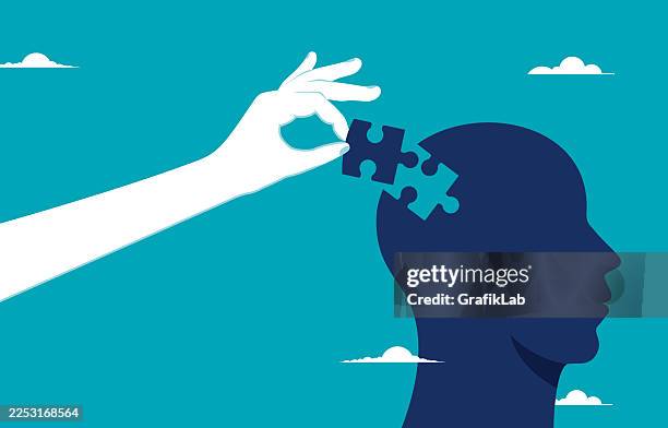 illustration of hand inserting puzzle piece into head silhouette, symbolizing problem-solving, mental health, cognitive development against teal background - emotional intelligence stock illustrations