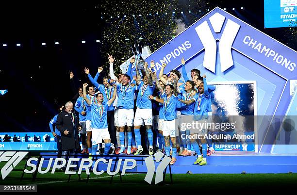 Giovanni Di Lorenzo of SSC Napoli lifts the Supercoppa Italiana trophy after the team's victory in the Supercoppa Italiana Final between SSC Napoli...