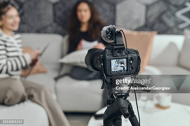 behind-the-scenes podcast recording with female hosts talking - tv program bildbanksfoton och bilder