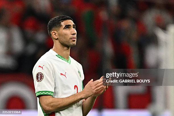 Morocco's defender Achraf Hakimi applauds during the Africa Cup of Nations group stage football match between Zambia and Morocco at Prince Moulay...