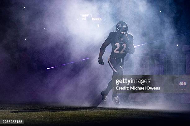 Derrick Henry of the Baltimore Ravens takes the field prior to an NFL football game against the New England Patriots at M&T Bank Stadium on December...
