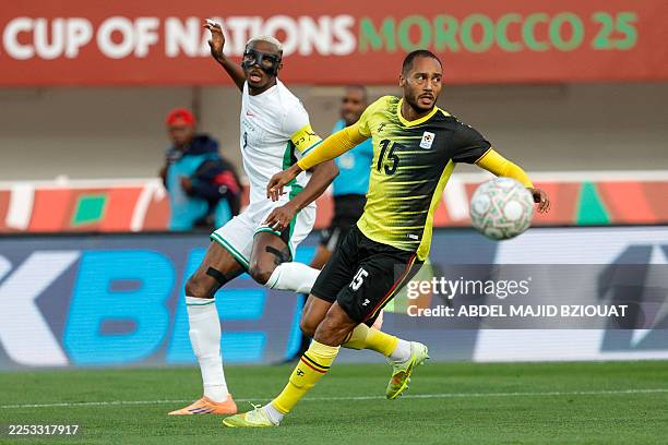 Nigeria's forward Victor Osimhen and Uganda's defender Jordan Obita during the Africa Cup of Nations Group C football match between Uganda and...