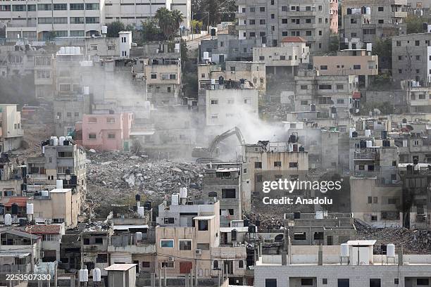 Israeli bulldozers demolish the homes as they raid the Nur Shams Refugee Camp in Tulkarem, located in the northern parts of West Bank on December 31,...