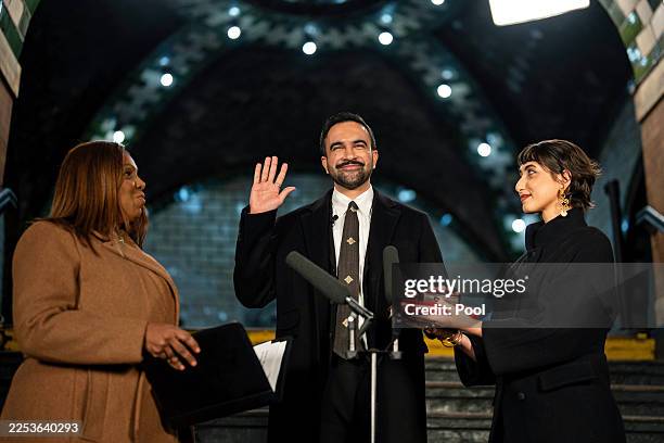 Zohran Mamdani is sworn in as New York City's 112th mayor by New York Attorney General Letitia James, left, alongside his wife Rama Duwaji, right, in...