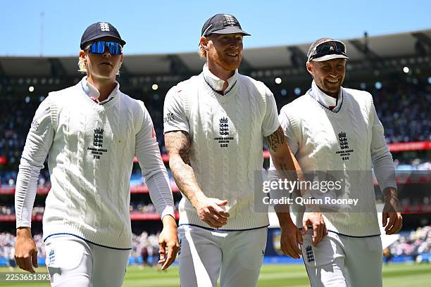 Jacob Bethell, Ben Stokes and Joe Root of England are seen as they leave the field during day two of the Fourth Test in the 2025/26 Ashes Series...