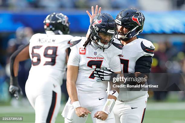 Stroud celebrates a touchdown pass with Jake Andrews of the Houston Texans during the first quarter against the Los Angeles Chargers at SoFi Stadium...