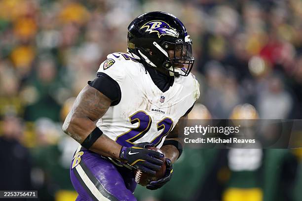 Derrick Henry of the Baltimore Ravens runs with the ball in the third quarter against the Green Bay Packers at Lambeau Field on December 27, 2025 in...