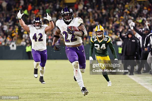 Derrick Henry of the Baltimore Ravens runs with the ball in the fourth quarter against the Green Bay Packers at Lambeau Field on December 27, 2025 in...