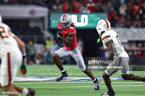 Ohio State Buckeyes wide receiver Jeremiah Smith runs up field after a catch during the CFP Quarterfinal Cotton Bowl Classic football game between...