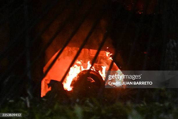 Vehicle burns at La Carlota air base in Caracas after a series of explosions on January 3, 2026. Loud explosions, accompanied by sounds resembling...