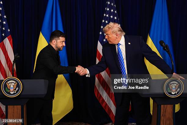President Donald Trump and Ukrainian President Volodymyr Zelensky shake hands at a news conference following a meeting at Trump’s Mar-a-Lago club on...