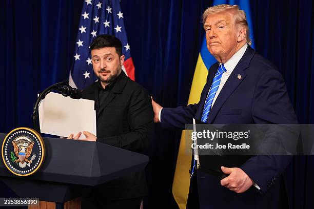 President Donald Trump and Ukrainian President Volodymyr Zelensky leave a press conference following their meeting at Trump’s Mar-a-Lago club on...