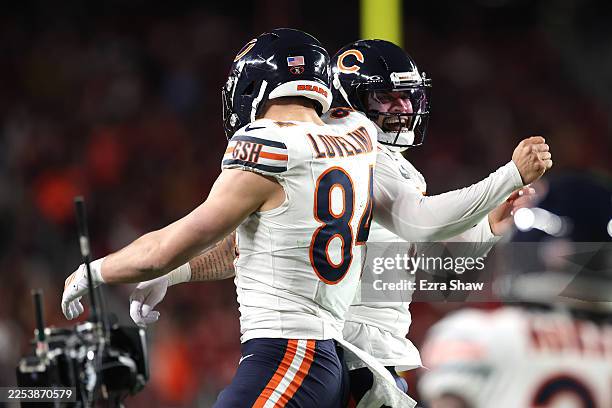 Colston Loveland of the Chicago Bears celebrates a touchdown against the San Francisco 49ers with quarterback Caleb Williams of the Chicago Bears...