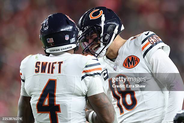 Caleb Williams of the Chicago Bears congratulates D'Andre Swift of the Chicago Bears after scoring a touchdown against the San Francisco 49ers during...