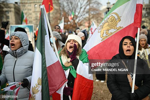 Activists take part in a rally supporting protestors in Iran at Lafayette Square, across from the White House in Washington, DC on January 3, 2026....