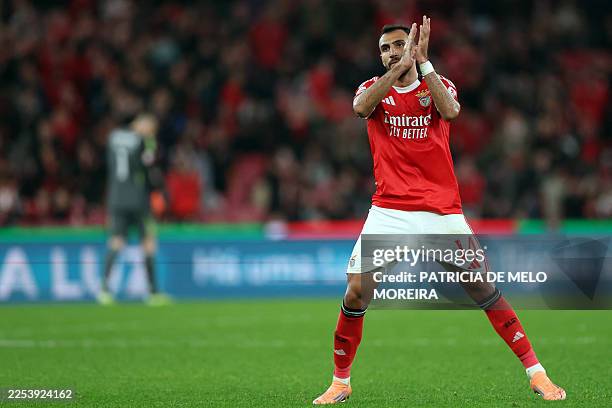Benfica's Greek forward Vangelis Pavlidis claps as he leaves the pitch during the Portuguese League football match between SL Benfica and GD Estoril...