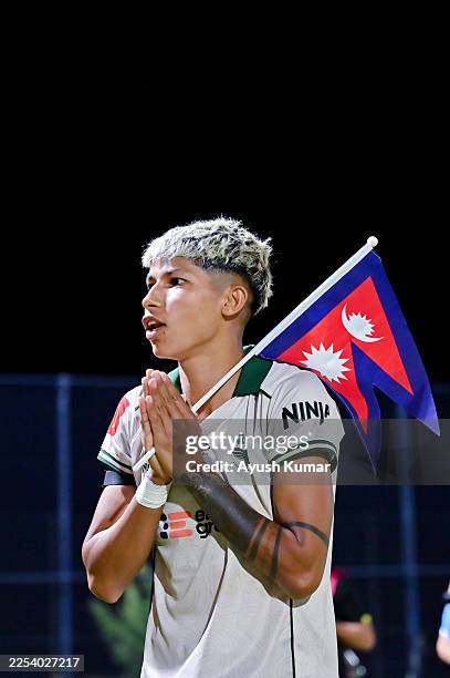 Sabitra Bhandari of Wellington Phoenix gestures to the fans while holding the Flag of Nepal during the round 10 A-League Women match between Western...