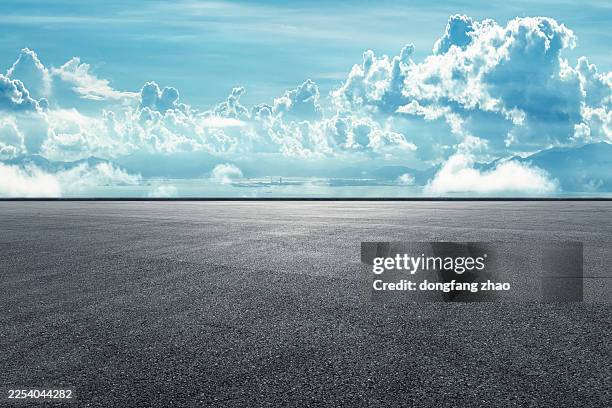 Empty asphalt road ground with beautiful mountain and blue sky background.