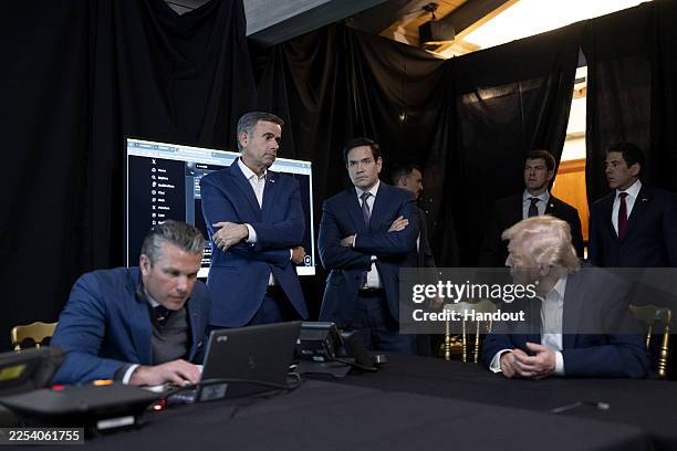 President Donald Trump, and Secretary of War Pete Hegseth, CIA Director John Ratcliffe and Secretary of State Marco Rubio monitor U.S. Military...